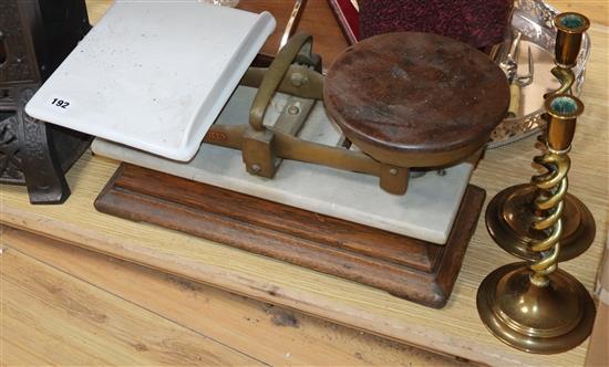 A cast iron conservatory heater, scales and brass candlesticks